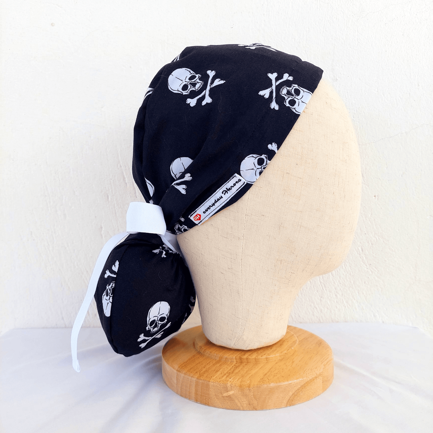 White Skull on a black Scrub Cap Ponytail