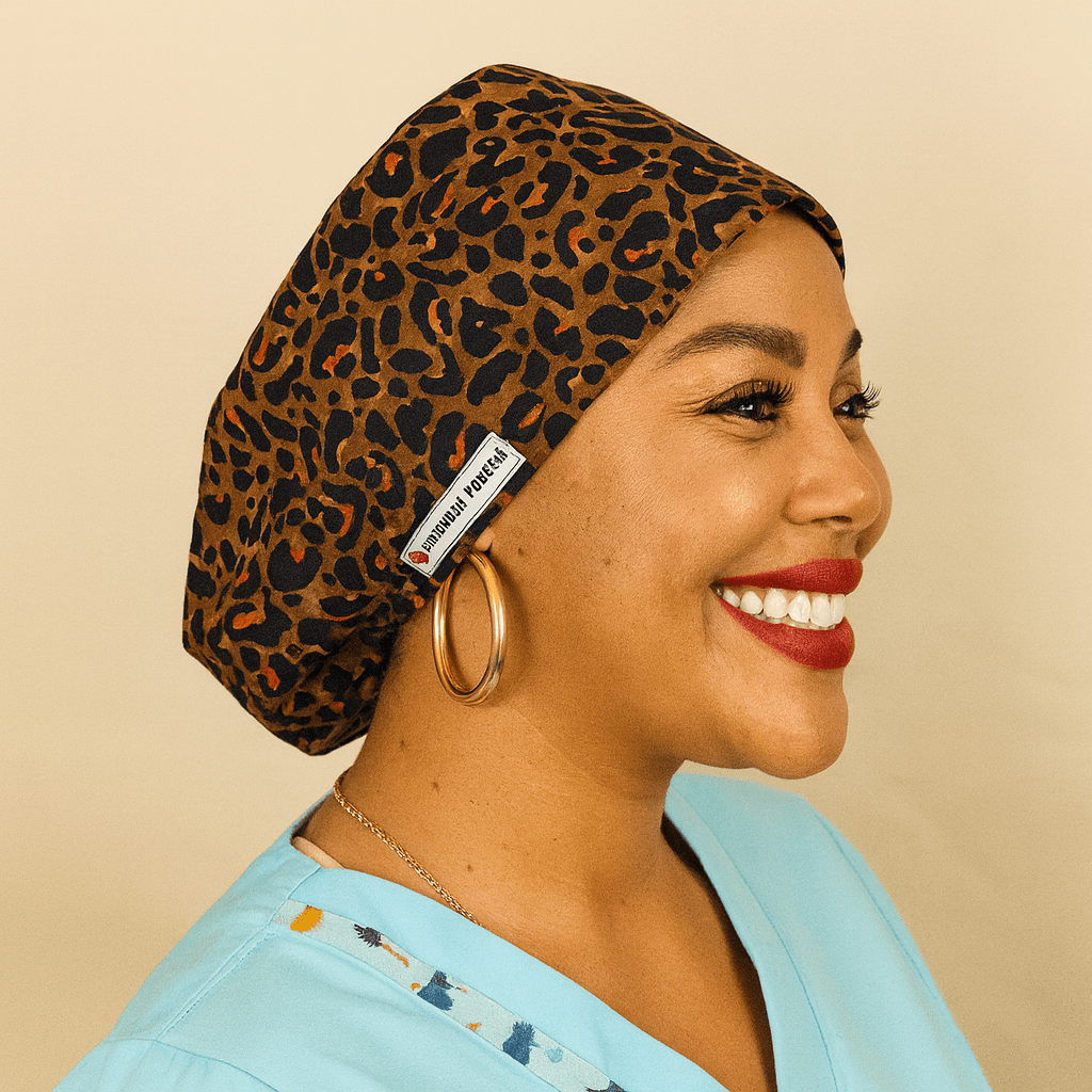 leopard scrub cap for women , the women on the photo is black and she is smiling