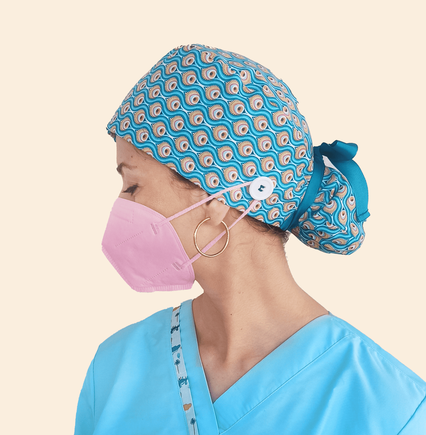 a woman wear a Peacock Feathers Scrub Cap Ponytail