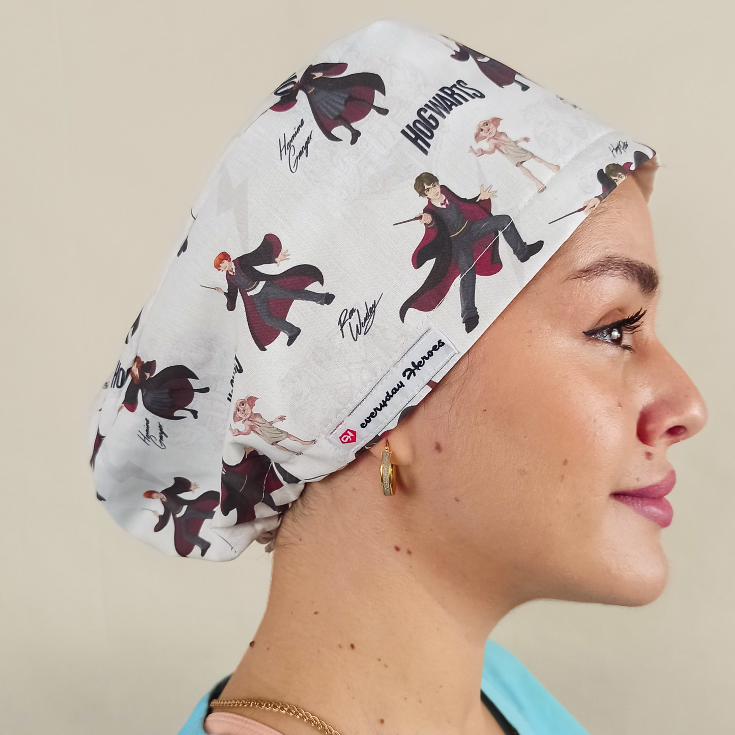 Magical, wizard-inspired scrub caps for women with an enchanted school of magic and spells theme fabric