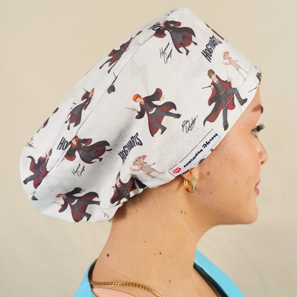 Magical, wizard-inspired scrub caps for women with an enchanted school of magic and spells theme fabric