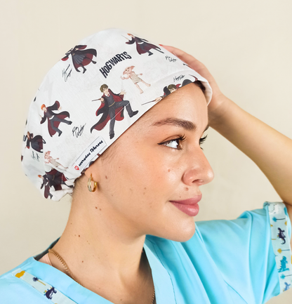 Magical, wizard-inspired scrub caps for women with an enchanted school of magic and spells theme fabric