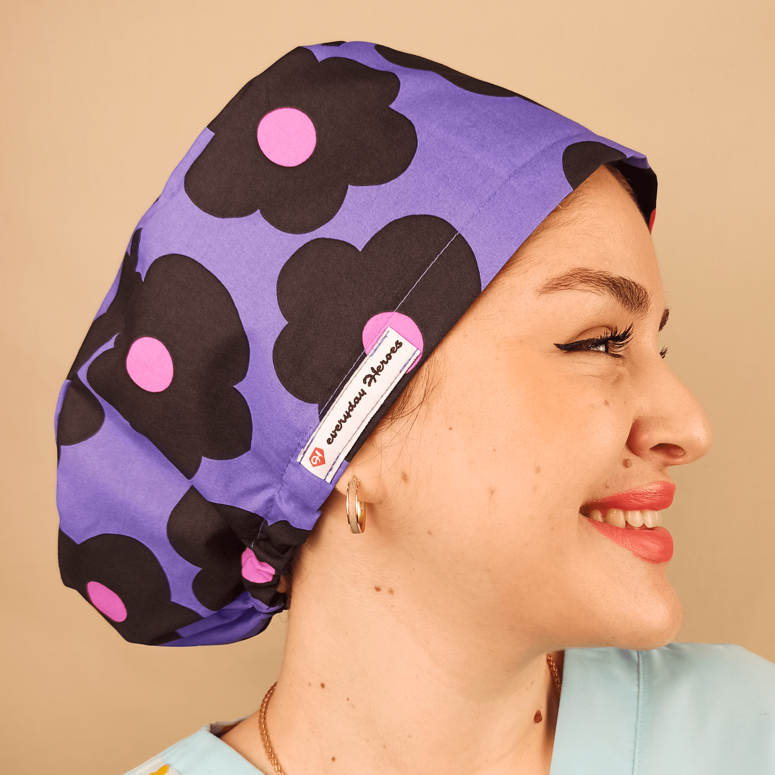 purple scrub cap with black and pink daisies, euro style surgical cap