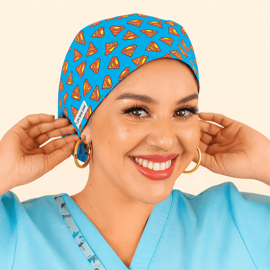 a super heroe nurse wearing a scrub hat euro style blue with the red logo smiling 